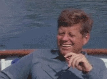 JFK laughing