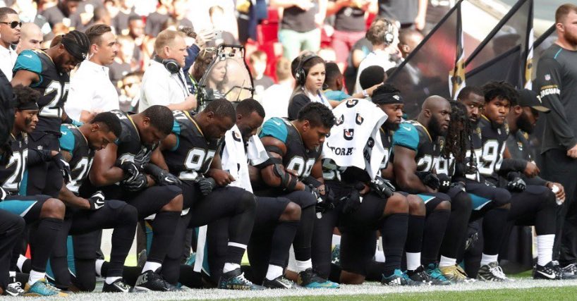 NFL players taking a knee